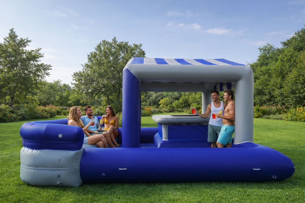 BAR GONFLABLE bleu foncé et gris clair Bar gonflable bleu foncé et gris de 6 m x 5 m, avec comptoir et assise pour 10 personnes, possibilité ou pas de brumisation.